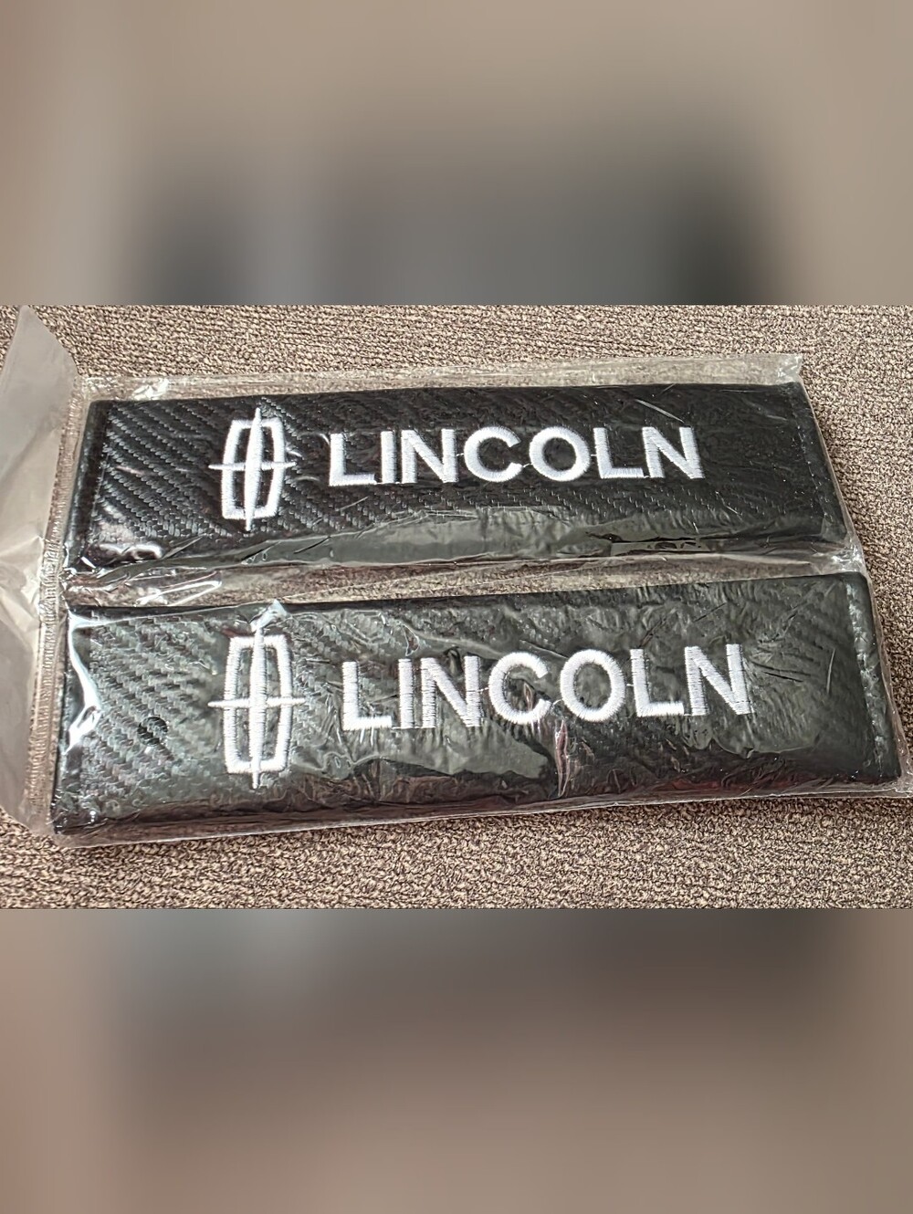 2 Lincoln carbon Fiber Universal seat belt pads Covers